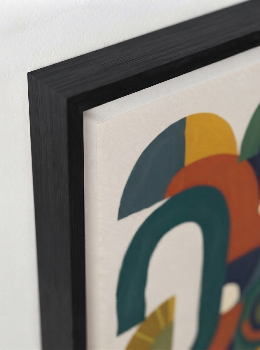 Close-up of a framed   Bauhaus Abstract Geometric Wall Poster created as eclectic contemporary wall decor from an original acrylic painting by Francis Phylae at Phylae Posters, with a black frame, featuring geometric shapes in teal, orange, yellow, and green on a white background.