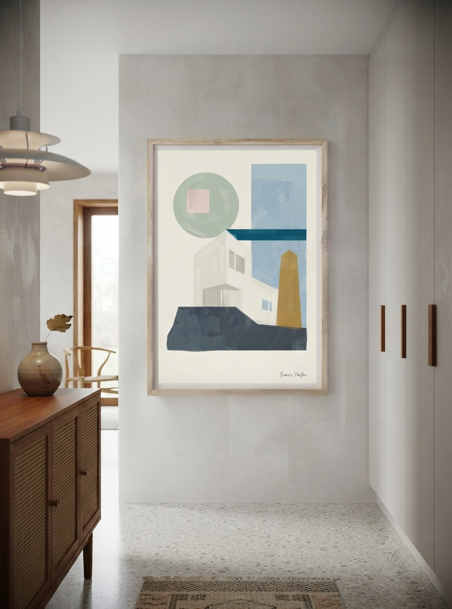 A framed Fine Art Print by Francis Phylae featuring a Bauhaus Geometric House Poster with elegant architectural abstraction and minimalist design,  hangs on a light gray wall in a modern hallway. The artwork features minimalist shapes in blue, green, white, yellow, and dark navy on a cream background.