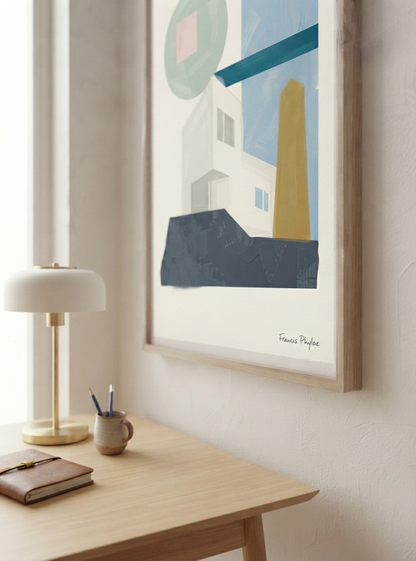 A framed  Modernist Architecture Wall Art featuring minimalist geometric architecture and contemporary Mid-Century Modern design by Phylae Posters.featuring geometric shapes in blue, green, white, yellow, and dark gray, hanging on a light beige wall above a wooden desk with a lamp and notebook.