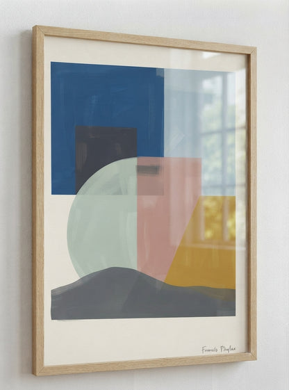 A framed Mid-Century Modern Geometric Landscape Art Print with geometric abstract landscape composition and organic modern design by Francis Phylae at Phylae Posters featuring blocks of blue, pink, yellow, gray, and pale green on a cream background, housed in a light natural wood frame and hung on a white wall.